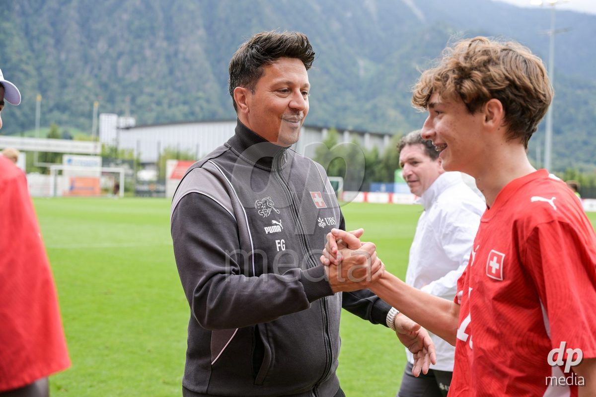 CHUR, SWITZERLAND - September 10: Francesco Gabriele, head coach of Switzerland U16, celebrates the performance with his players. of Switzerland celebrate the victory after the International friendly match between Switzerland U16 and Luxembourg U16 at Stade de Chur on September 10,2026 in Chur, Switzerland