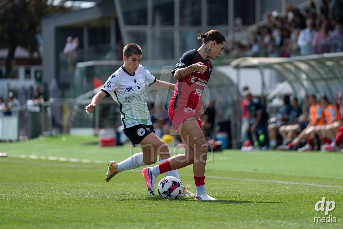 YVERDON-LES-BAINS - SWITZERLAND - SEPTEMBER 13 : Duel between Laura Tufo of Yverdon Sport Women and Vanesa Hoti of FC Aarau Frauen during the AXA Women's Super League match between Yverdon Sport Women and FC Aarau Frauen at Stade Municipal on September 13, 2026 in Yverdon-les-Bains, Switzerland.