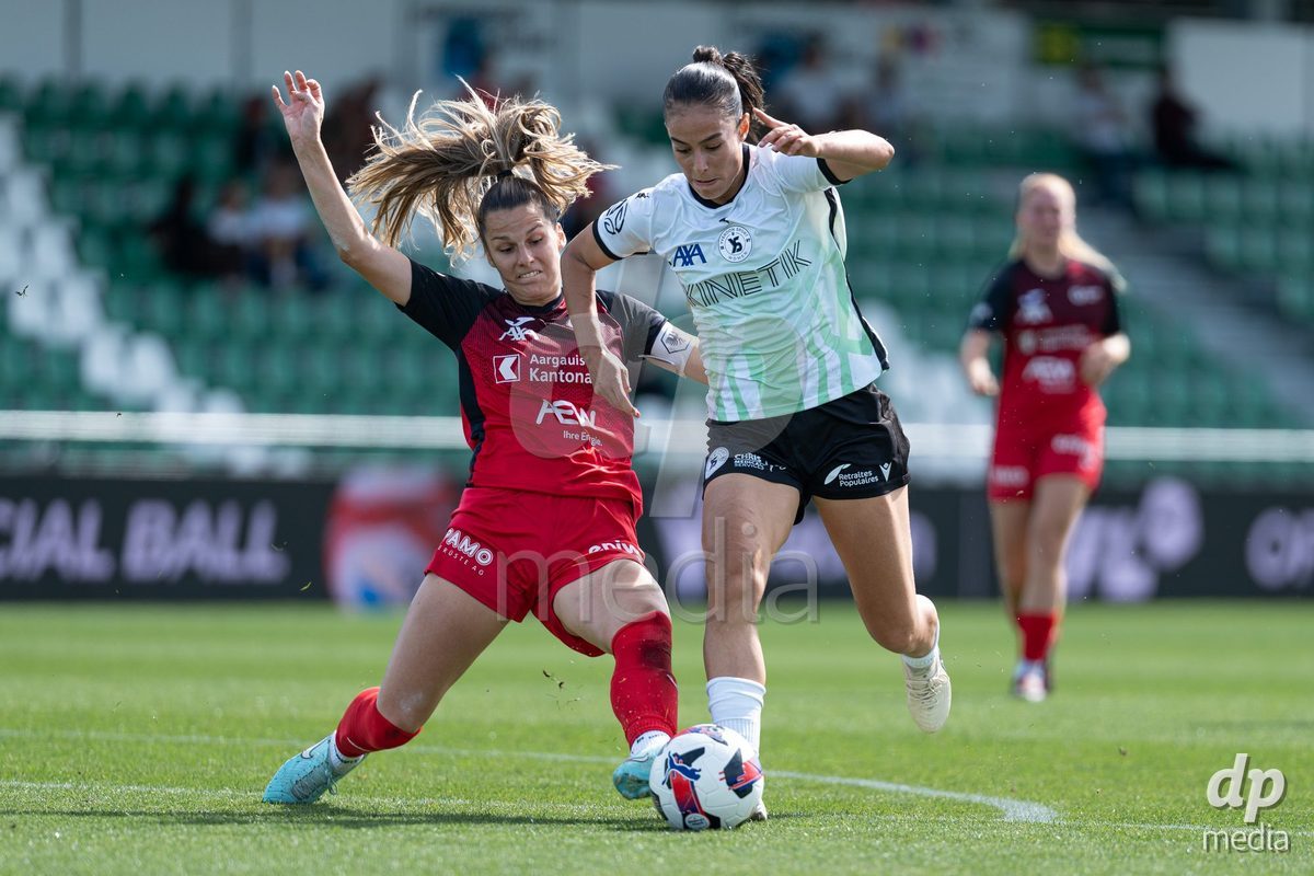 YVERDON-LES-BAINS - SWITZERLAND - SEPTEMBER 13 : Duel between Ines Khiri of Yverdon Sport Women and Celia Hofer of FC Aarau Frauen during the AXA Women's Super League match between Yverdon Sport Women and FC Aarau Frauen at Stade Municipal on September 13, 2026 in Yverdon-les-Bains, Switzerland.