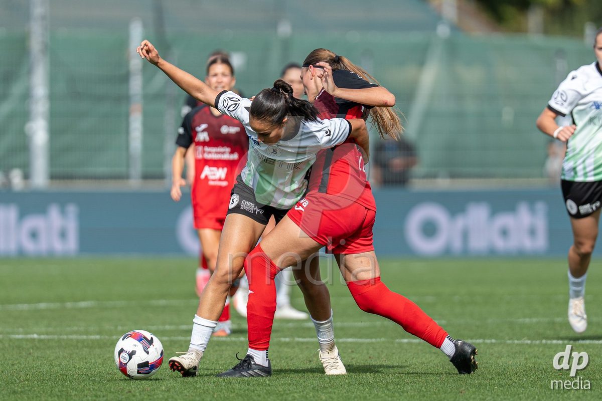 YVERDON-LES-BAINS - SWITZERLAND - SEPTEMBER 13 : Duel between Ines Khiri of Yverdon Sport Women and Eriona Elezi of FC Aarau Frauen during the AXA Women's Super League match between Yverdon Sport Women and FC Aarau Frauen at Stade Municipal on September 13, 2026 in Yverdon-les-Bains, Switzerland.