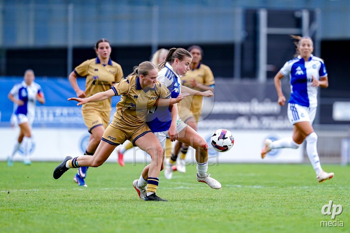NIEDERHASLI, SWITZERLAND - September 13: Giulia Looser of GC Frauenfussball (R) and Liel Rickenbach of FC Luzern (L) battle for the ball during the AXA Women's Super League match between GC Frauenfussball and FC Luzern at GC Campus on September 13, 2026 in Niederhasli, Switzerland.