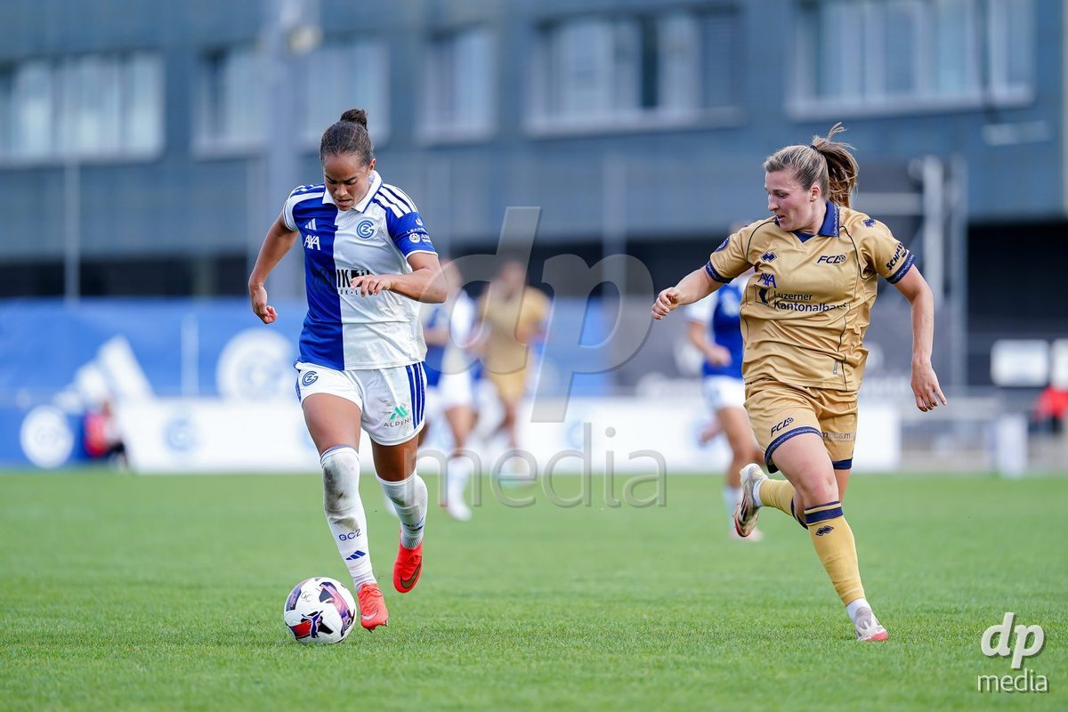 NIEDERHASLI, SWITZERLAND - September 13: Kayla Mckenna of GC Frauenfussball (R) and controls the ball during the AXA Women's Super League match between GC Frauenfussball and FC Luzern at GC Campus on September 13, 2026 in Niederhasli, Switzerland.