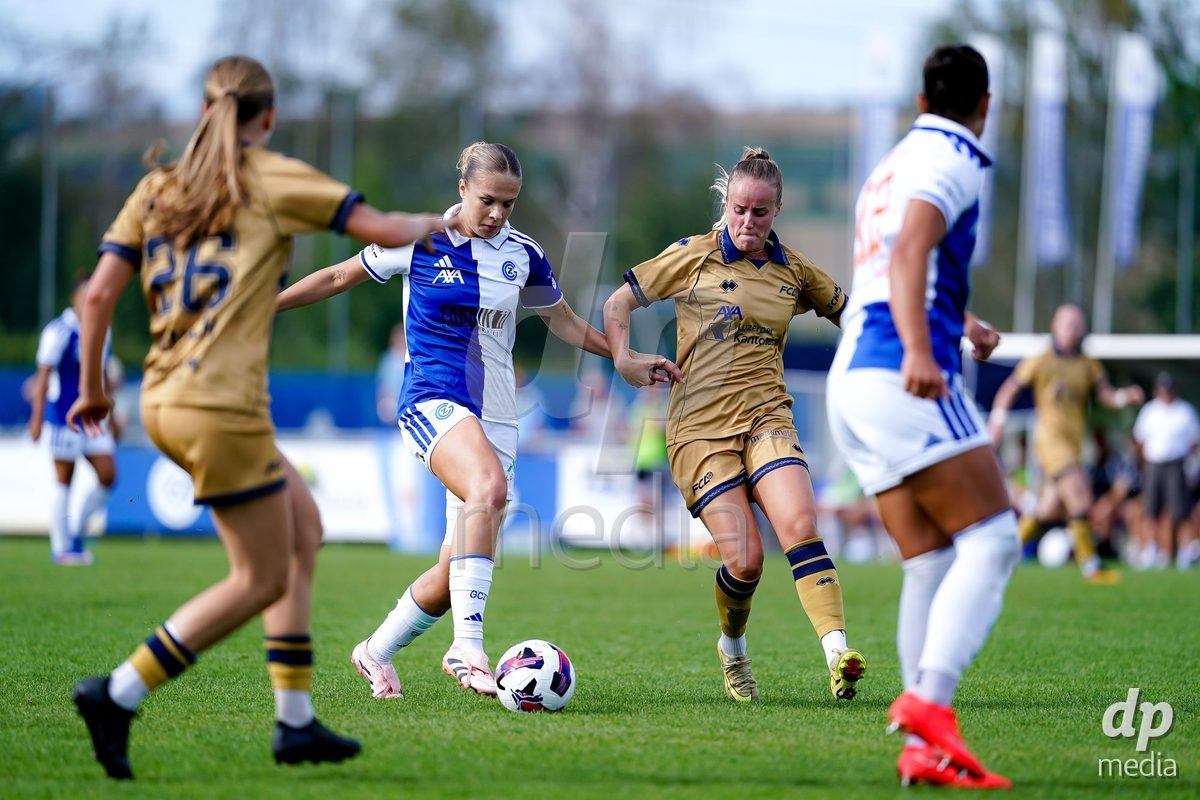 NIEDERHASLI, SWITZERLAND - September 13: Barbara Reger of FC Luzern (R) and Ella Ljustina of GC Frauenfussball (L) battle for the ball during the AXA Women's Super League match between GC Frauenfussball and FC Luzern at GC Campus on September 13, 2026 in Niederhasli, Switzerland.
