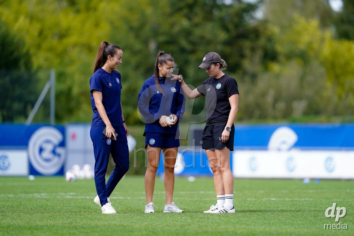 NIEDERHASLI, SWITZERLAND - September 13: Laura Vetterlein, Head Coach of GC Frauenfussball, (R), Luna Lemperiere of GC Frauenfussball (M) and Marta Cazalla of GC Frauenfussball (L) prior to the AXA Women's Super League match between GC Frauenfussball and FC Luzern at GC Campus on September 13, 2026 in Niederhasli, Switzerland.