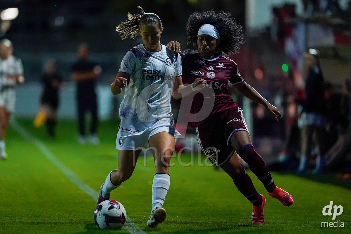 GENEVA, SWITZERLAND - SEPTEMBER 18: Mickaella Cardia (Mickaëlla Cardia) of Servette FC Chenois Feminin (R) and Amelie Schuster of FC Zurich (L) battle for the ball during the AXA Women's Super League match between Servette FC Chenois Feminin and FC Zurich at Stade de Trois-Chene on September 18, 2026 in Geneva, Switzerland.