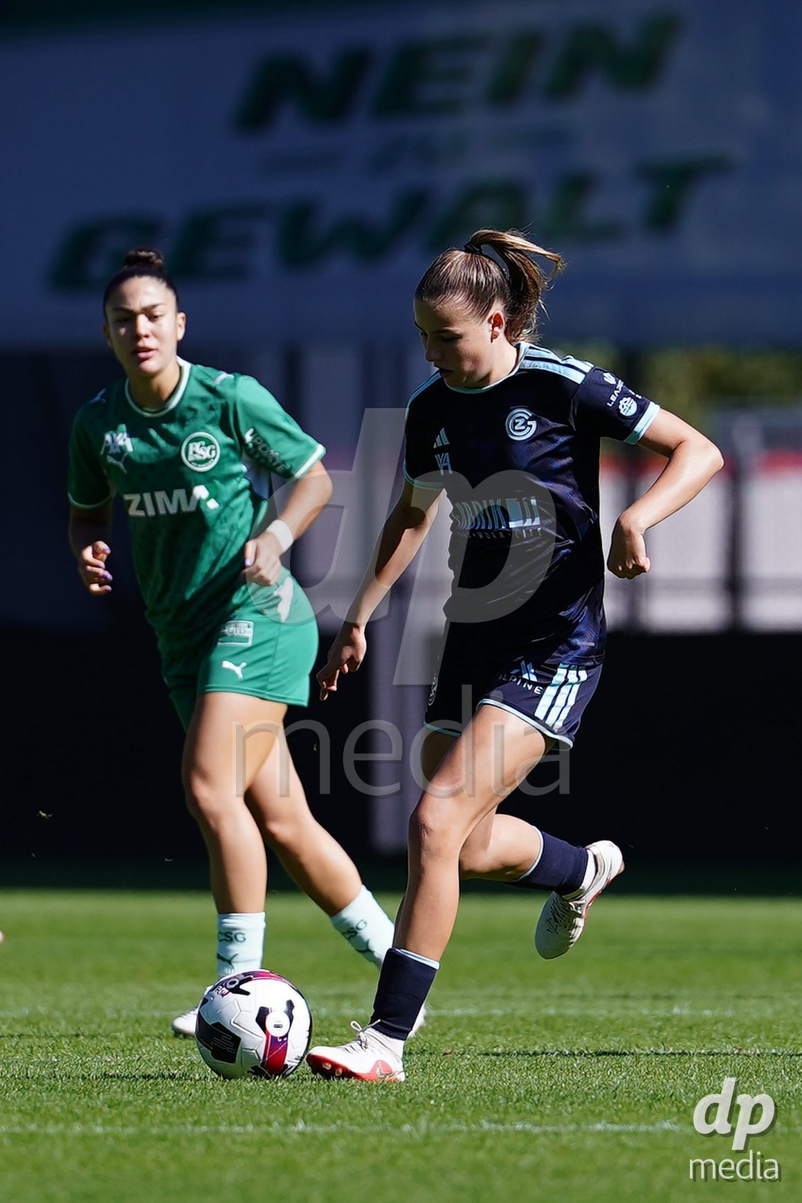 ST. GALLEN, SWITZERLAND - SEPTEMBER 19: Giulia Looser of GC Frauenfussballz (R) controls  the ball during the AXA Women's Super League match between FC St. Gallen 1879 and GC Frauenfussball at Berit Sitterstadion on September 19, 2026 in St. Gallen, Switzerland.