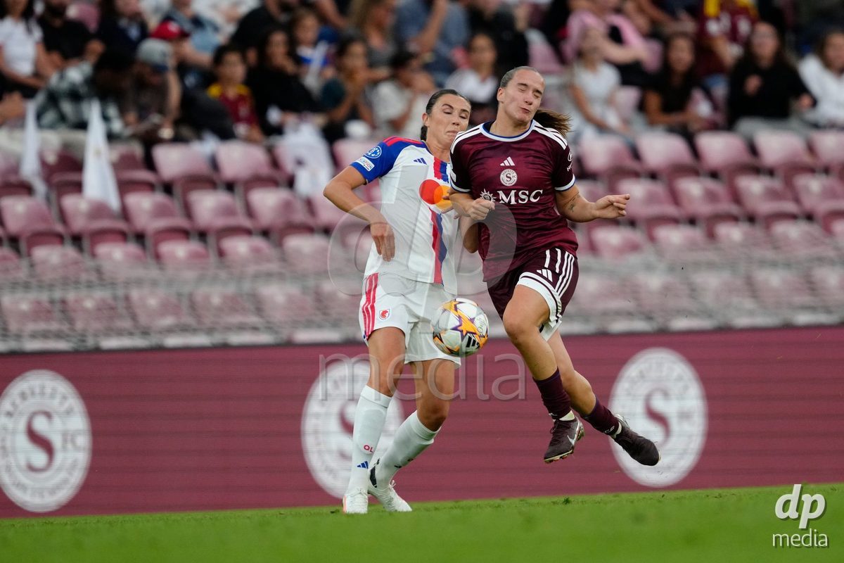 GENEVA, SWITZERLAND - SEPTEMBER 23: Magdalena Sobal of Servette FC Chenois Feminin against Ashley Lawrence of Olympique Lyon during the UEFA Women's Champions League match between Servette FC Chenois Feminin and OL Lyonnes at Stade de Geneve on September 23, 2026 in Geneva, Switzerland.