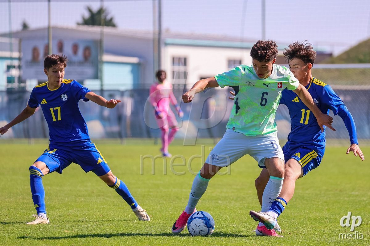 DUNAJSKA LUZNA, SLOVAKIA - SEPTEMBER 28: Ethan Bruchez 6 of Switzerland struggle for the ball during the friendly international football match between Kazakhstan U19 and Switzerland U19 on September 28, 2026 in Dunajska Luzna, Slovakia.