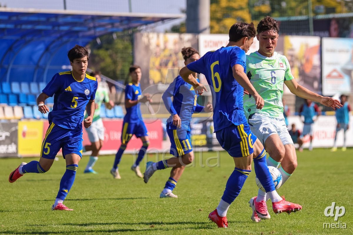 DUNAJSKA LUZNA, SLOVAKIA - SEPTEMBER 28: Ethan Bruchez 6 of Switzerland struggle for the ball during the friendly international football match between Kazakhstan U19 and Switzerland U19 on September 28, 2026 in Dunajska Luzna, Slovakia.