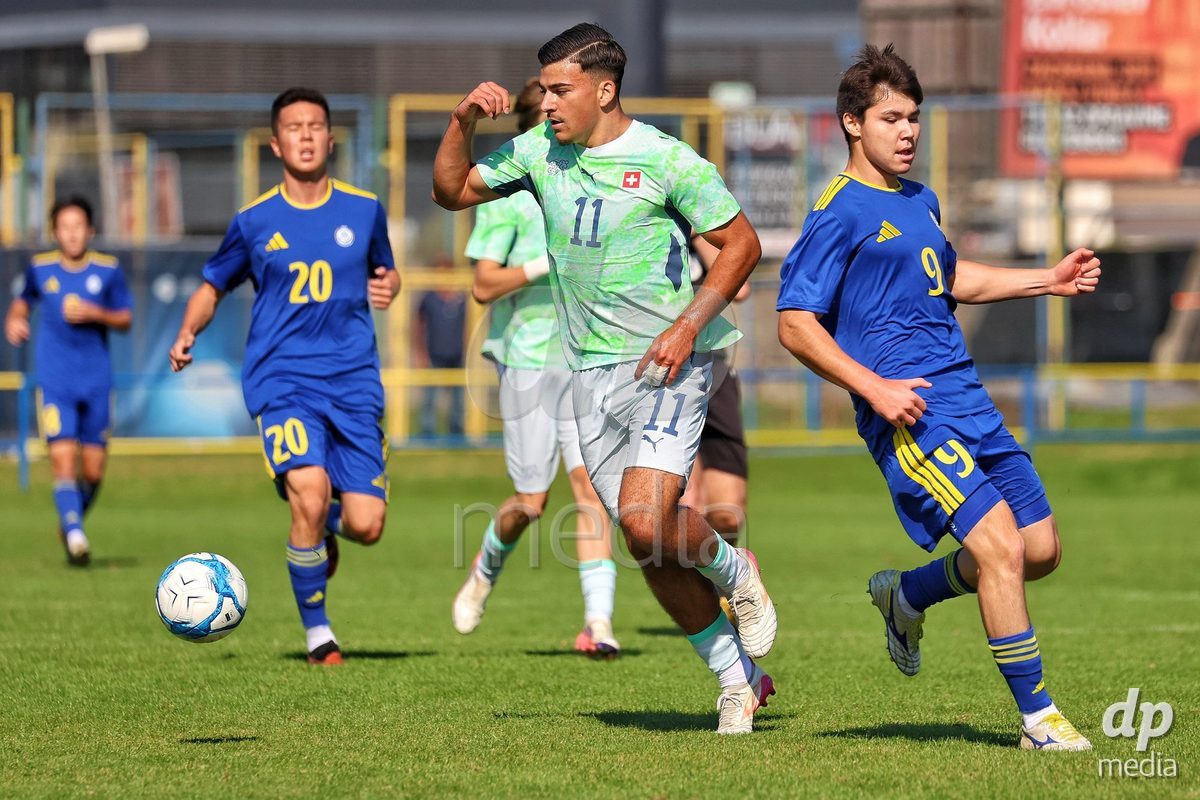 DUNAJSKA LUZNA, SLOVAKIA - SEPTEMBER 28: Nevio Scherrer 11 of Switzerland struggle for the ball during the friendly international football match between Kazakhstan U19 and Switzerland U19 on September 28, 2026 in Dunajska Luzna, Slovakia.