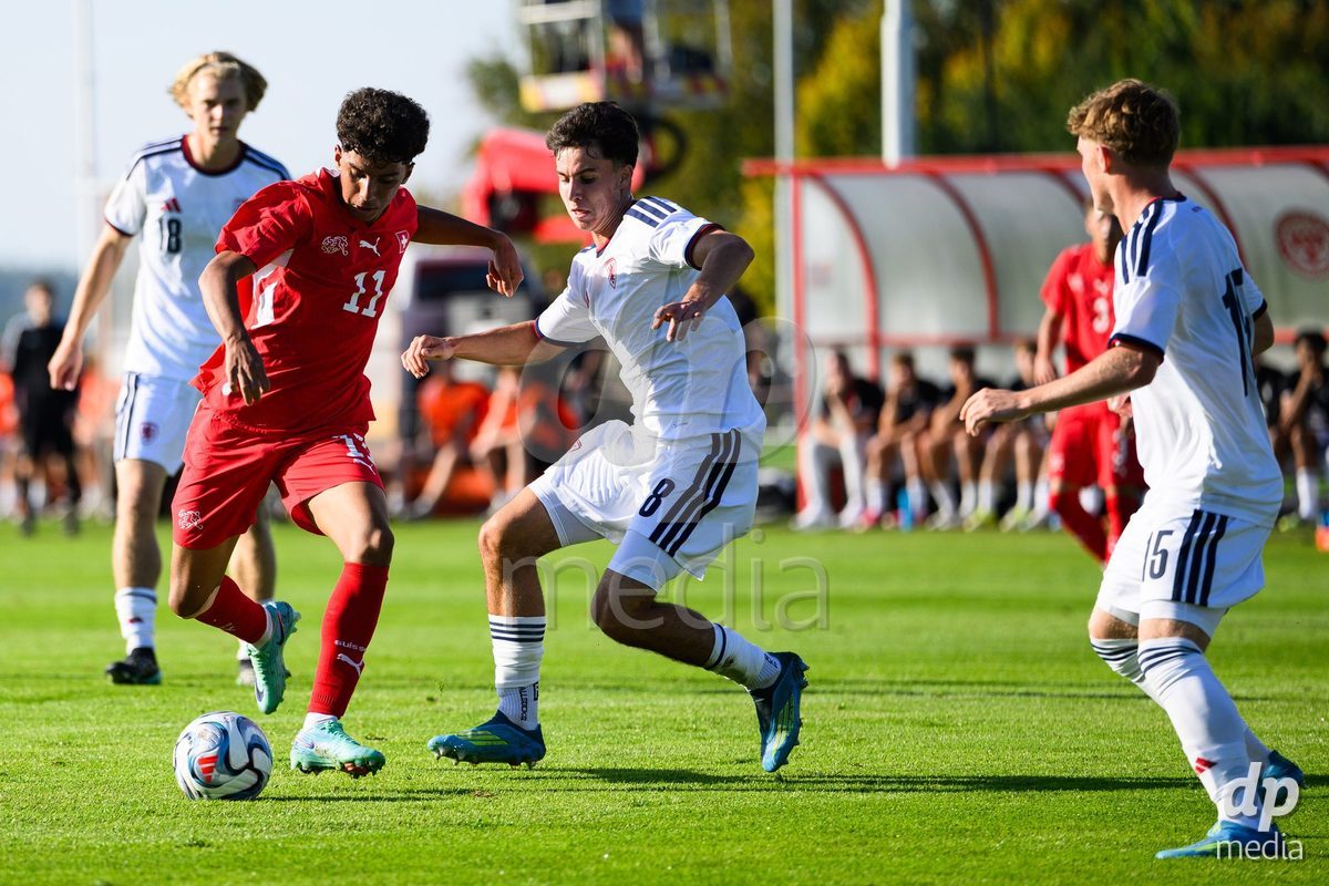 KOSMONSY, CZECH REPUBLIC - SEPTEMBER 28: Jean Doucoure of Switzerland (left) and Ondrej Masek of Czechia during the International Friendly match between Czech Republic U18 and Switzerland U18 on September 28, 2026 in Kosmonsy, Czech Republic.