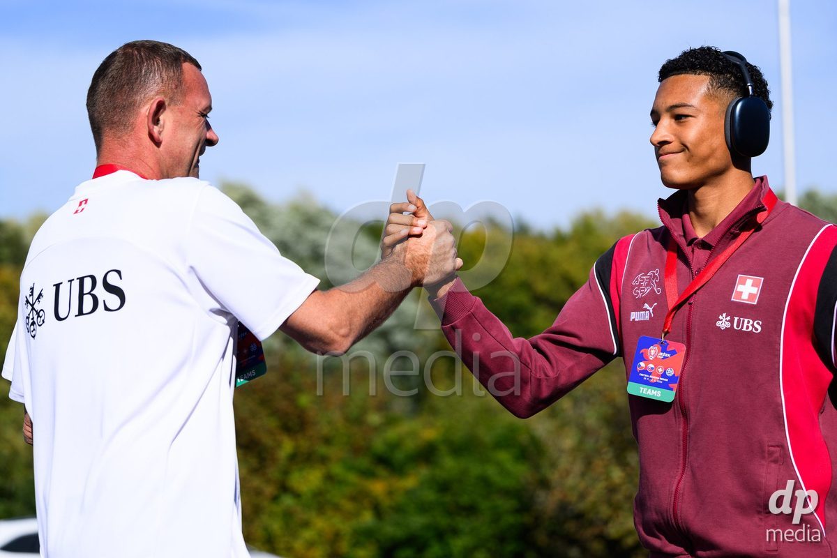 KOSMONSY, CZECH REPUBLIC - SEPTEMBER 30: Kit man Alexandre Tschiember (left) and Sven Strassmann of Switzerland during the team's arrival at the stadium  before the International Friendly match between Switzerland U18 and Greece U18 on September 30, 2026 in Kosmonsy, Czech Republic.