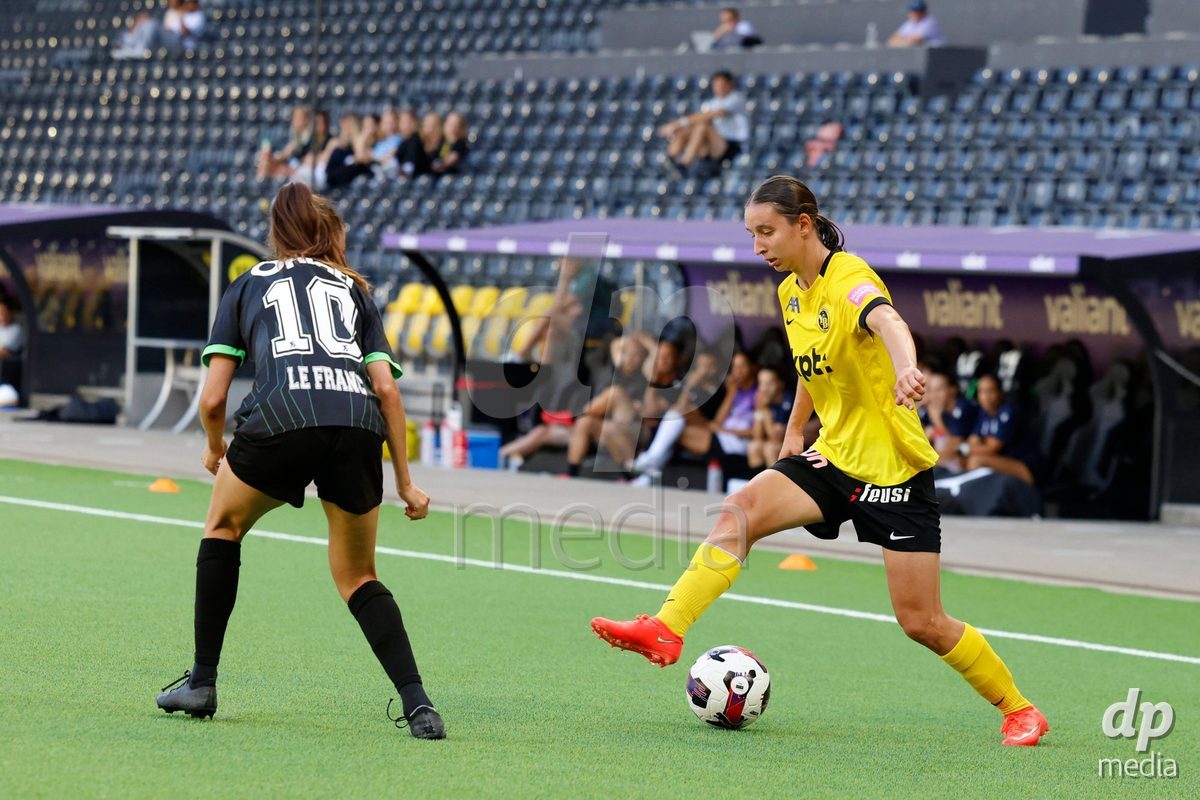 BERN, SWITZERLAND  - September 6: Malaurie Granges (13) of BSC Young Boys in duel with Chloe Marie Anne Le Franc (10) of Yverdon Sport Feminin during the AXA Women's Super League match between BSC YB Frauen and FC Yverdon Women at Wankdorf Stadion on September 6, 2026 in Bern, Switzerland.