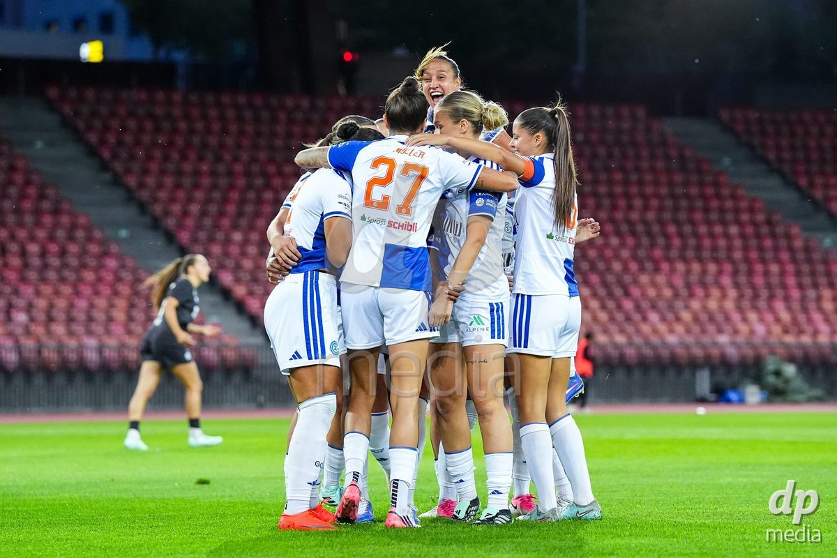 ZURICH, SWITZERLAND - OCTOBER 2: Kayla Mckenna of Grasshopper Club Zurich (L) celebrates with teammates after scoring her teams first goal during the AXA Women's Super League match between GC Frauenfussball and FC Zurich at Letzigrund on October 2, 2026 in Zurich, Switzerland.