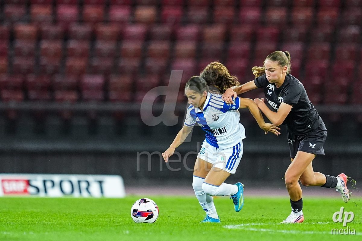 ZURICH, SWITZERLAND - OCTOBER 2: Ilaria Maddaloni of Grasshopper Club Zurich (L) battles for the ball (duel) during the AXA Women's Super League match between GC Frauenfussball and FC Zurich at Letzigrund on October 2, 2026 in Zurich, Switzerland.