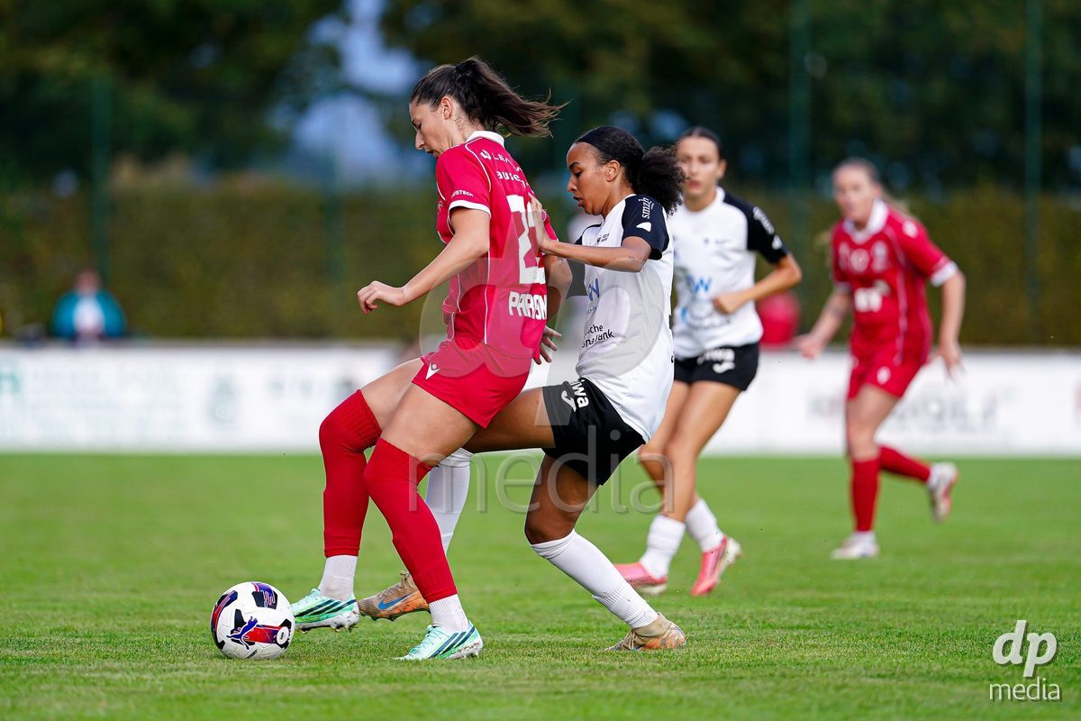 RAPPERSWIL, SWITZERLAND - OCTOBER 3: Joy Steck of FC Aarau Frauen (R) and Zdravka Petrova Parapunova of FC Rapperswil-Jona (L) battle for the ball during the AXA Women's Super League match between FC Rapperswil-Jona and FC Aarau Frauen at Grunfeld on October 3, 2026 in Rapperswil, Switzerland.