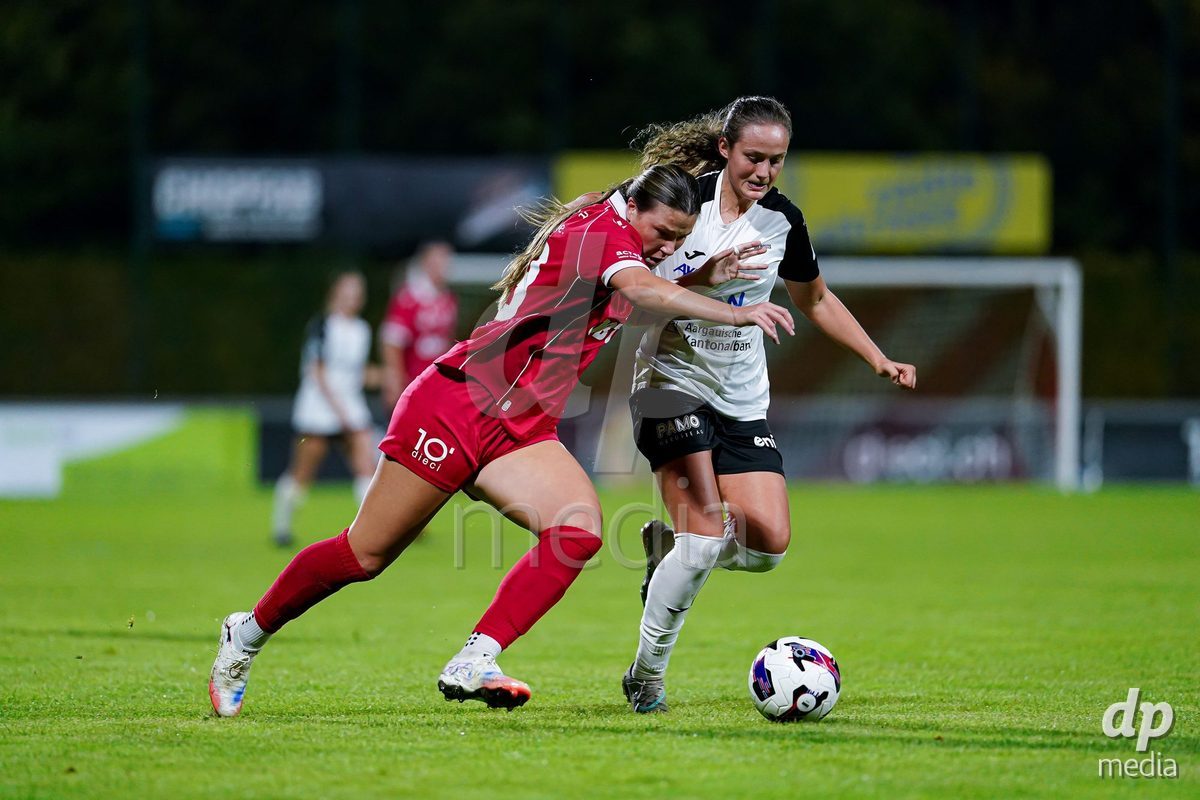 RAPPERSWIL, SWITZERLAND - OCTOBER 3: Martina Cocino of FC Aarau Frauen (R) and Olivia Halina Borgen of FC Rapperswil-Jona (L) battle for the ball during the AXA Women's Super League match between FC Rapperswil-Jona and FC Aarau Frauen at Grunfeld on October 3, 2026 in Rapperswil, Switzerland.