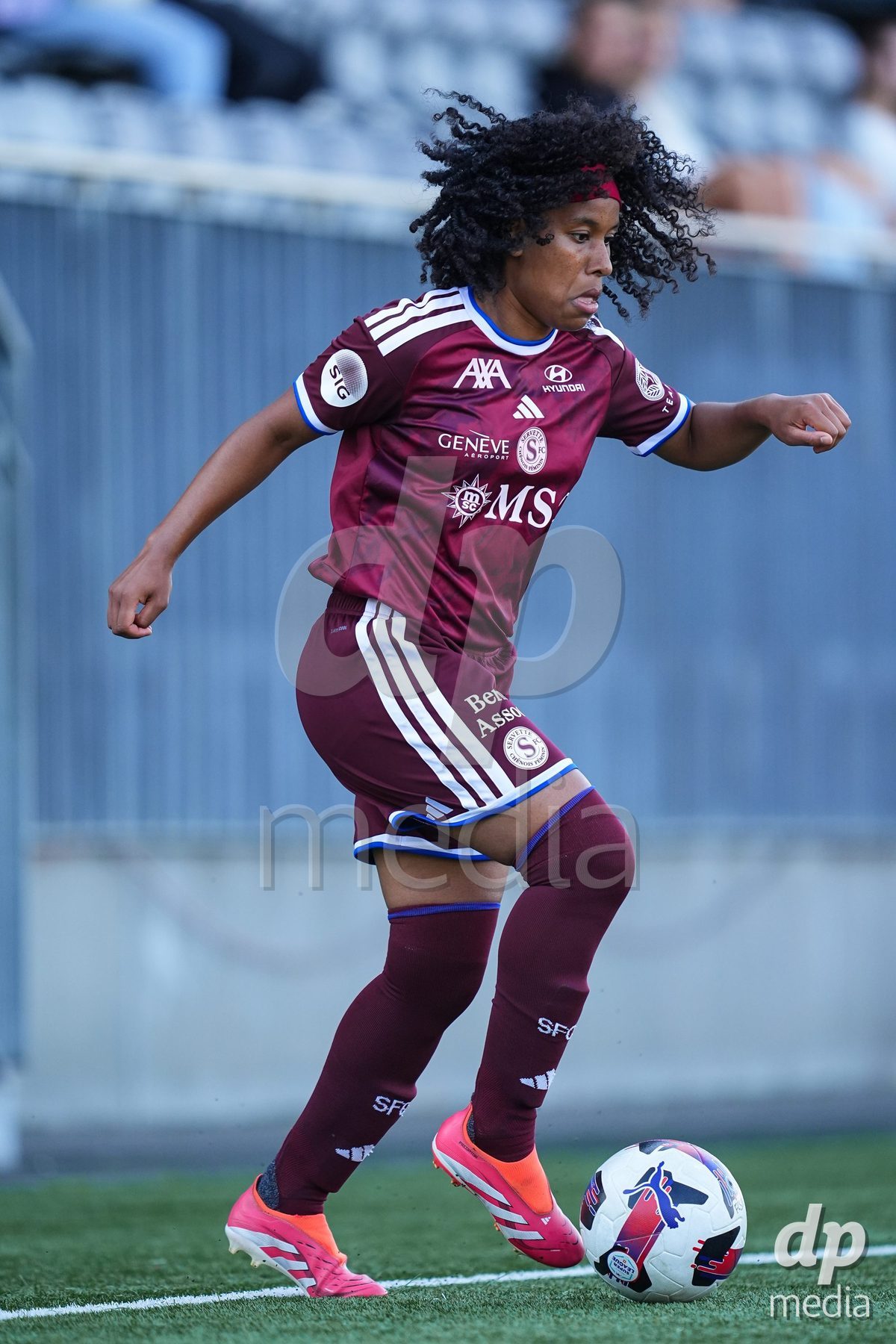WIL, SWITZERLAND - OCTOBER 4: Mickaella Francoise Halooa Cardia of Servette FC Chenois Feminin controls the ball during the AXA Women's Super League match between FC St. Gallen 1879 and Servette FC Chenois Feminin at Lidl Sportpark on October 4, 2026 in Wil, Switzerland.