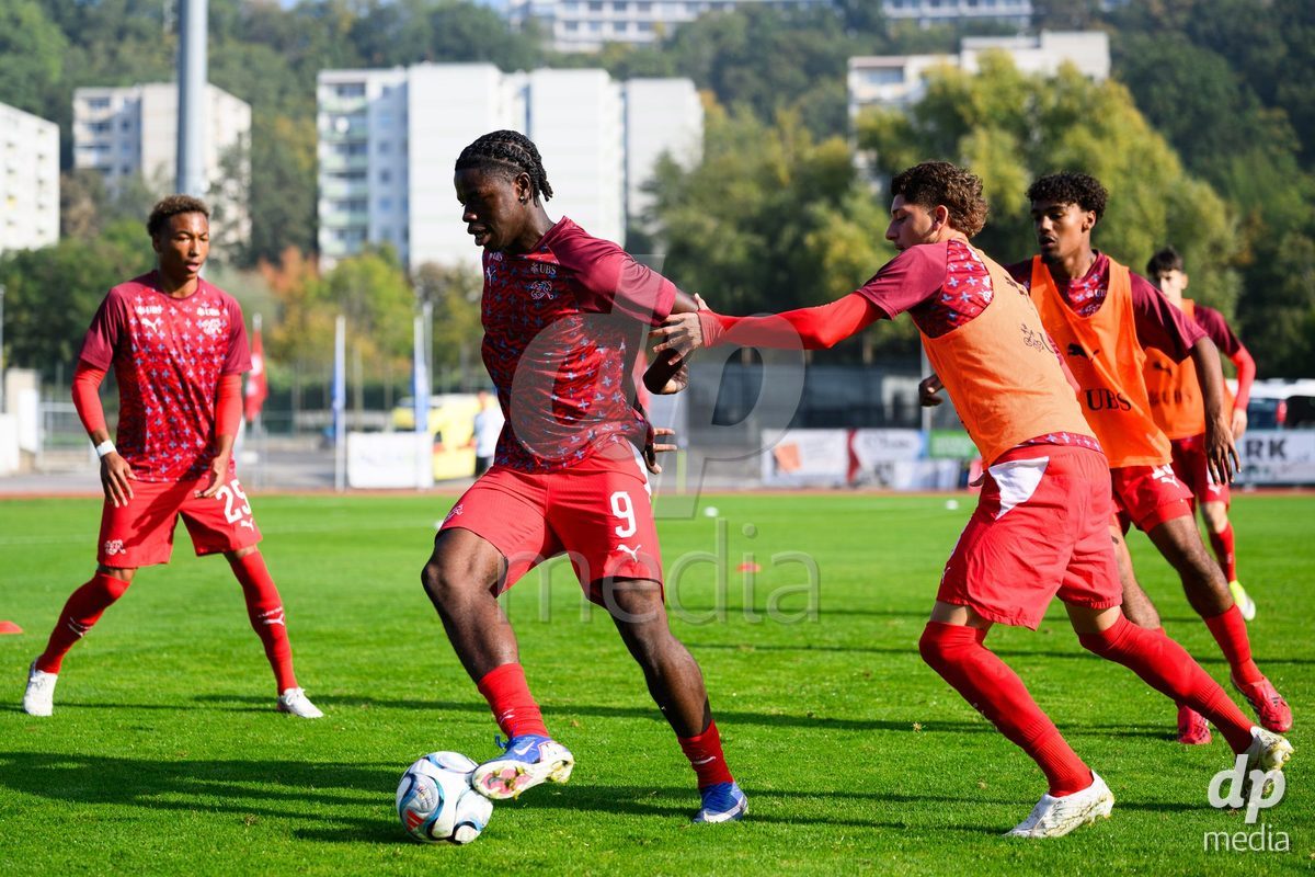 USTI NAD LABEM, CZECH REPUBLIC - OCTOBER 3: Mathis Dind (left), Shedrach Ogbodu and Gabriel Roskovic of Switzerland during warm up before the International Friendly match between Slovakia and Switzerland on October 3, 2026 in Ustí nad Labem, Czech Republic.