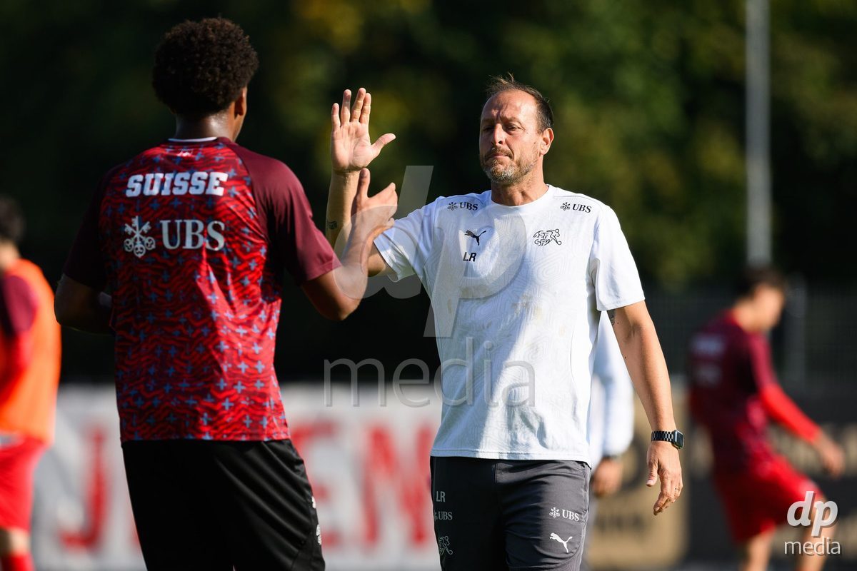 USTI NAD LABEM, CZECH REPUBLIC - OCTOBER 3:   Elijah Muogbo of Switzerland and goalkeeper coach Luca Redaelli during warm up before the International Friendly match between Slovakia and Switzerland on October 3, 2026 in Ustí nad Labem, Czech Republic.