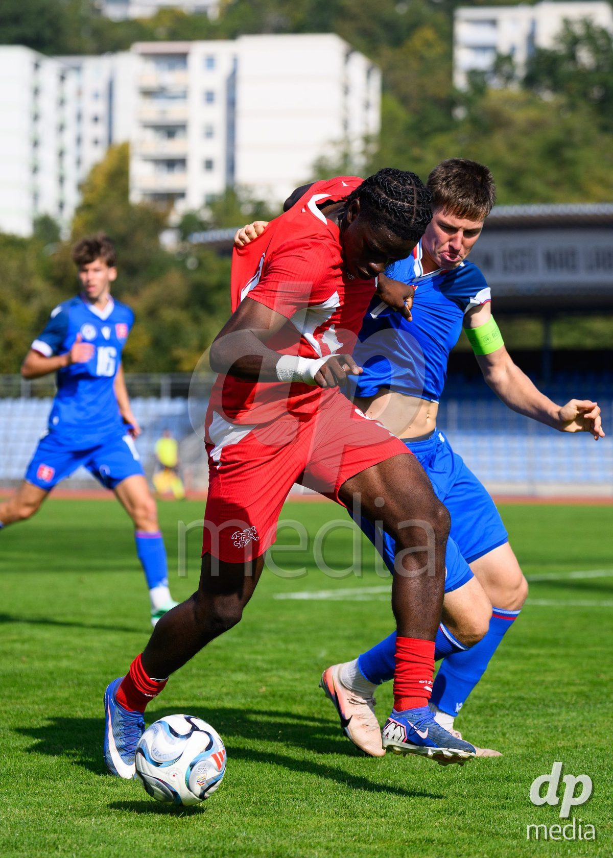 USTI NAD LABEM, CZECH REPUBLIC - OCTOBER 3: Shedrach Ogbodu of Switzerland (left) and Simon Hubona of Slovakia during the International Friendly match between Slovakia and Switzerland on October 3, 2026 in Ustí nad Labem, Czech Republic.