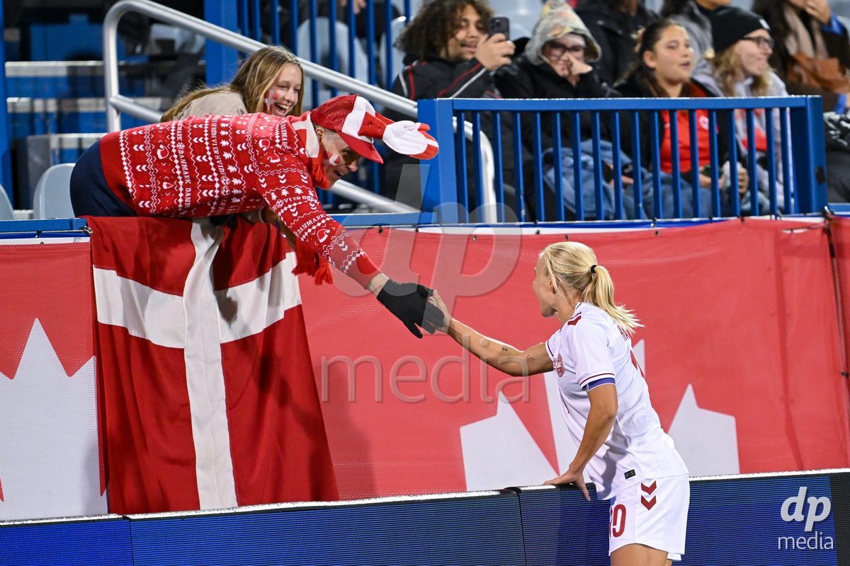 MONTREAL, CANADA - OCTOBER 9: Pernille Harder of Denmark celebrates with a fan after scoring her teams first goal during the International Women's Friendly football match between Canada and Denmark at Stade Saputo on October 9, 2026 in Montreal, Canada.