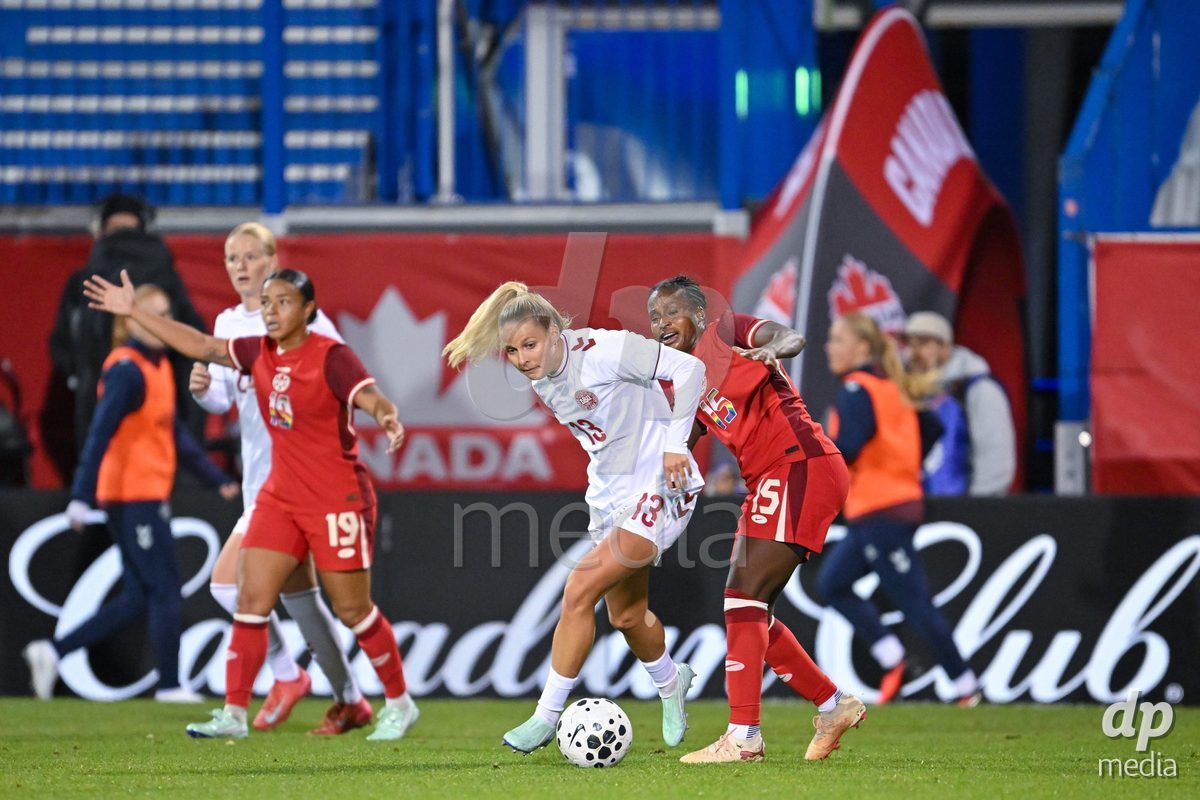 MONTREAL, CANADA - OCTOBER 9: Olivia Holdt of Denmark (L) and Nichelle Prince of Canada (R) battle for the ball (duel) during the International Women's Friendly football match between Canada and Denmark at Stade Saputo on October 9, 2026 in Montreal, Canada.
