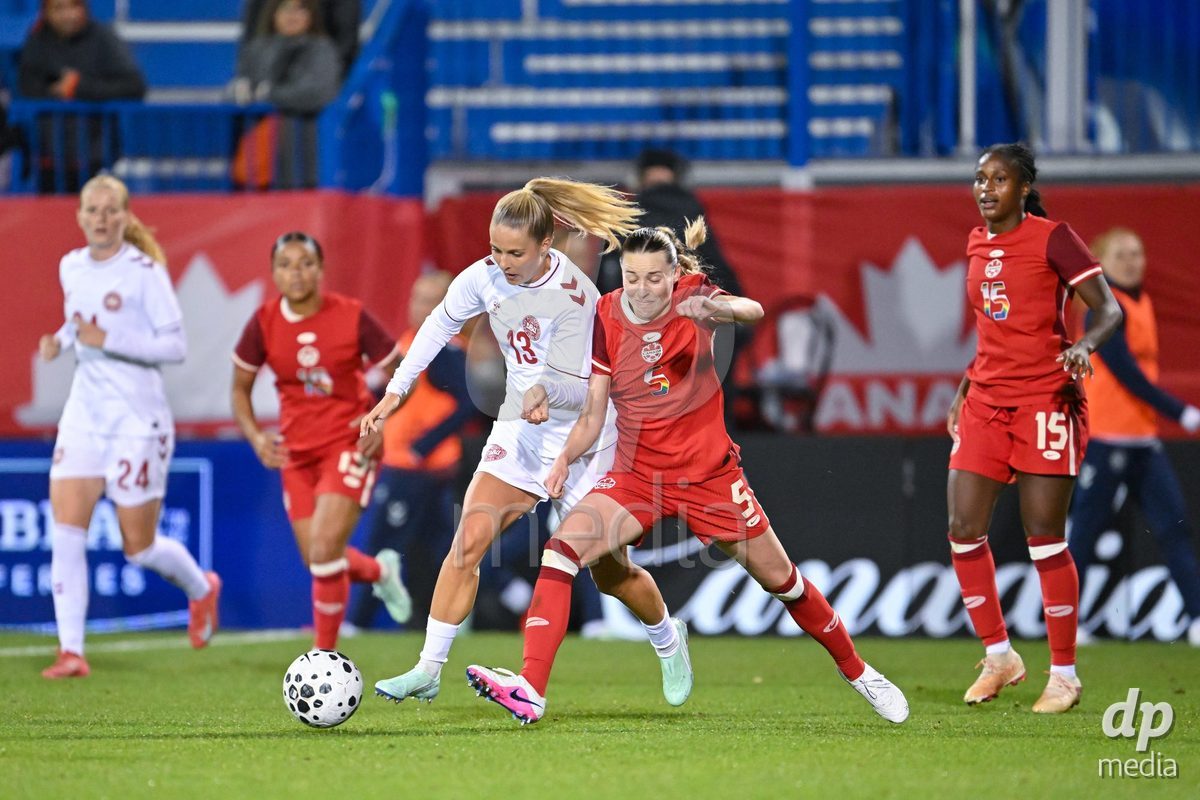 MONTREAL, CANADA - OCTOBER 9: Olivia Holdt of Denmark (L) and Gabrielle Carle of Canada (R) battle for the ball (duel) during the International Women's Friendly football match between Canada and Denmark at Stade Saputo on October 9, 2026 in Montreal, Canada.