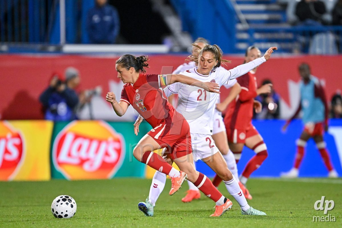 MONTREAL, CANADA - OCTOBER 9: Mille Gejl of Denmark (R) tackles Jessie Fleming of Canada (L) during the International Women's Friendly football match between Canada and Denmark at Stade Saputo on October 9, 2026 in Montreal, Canada.