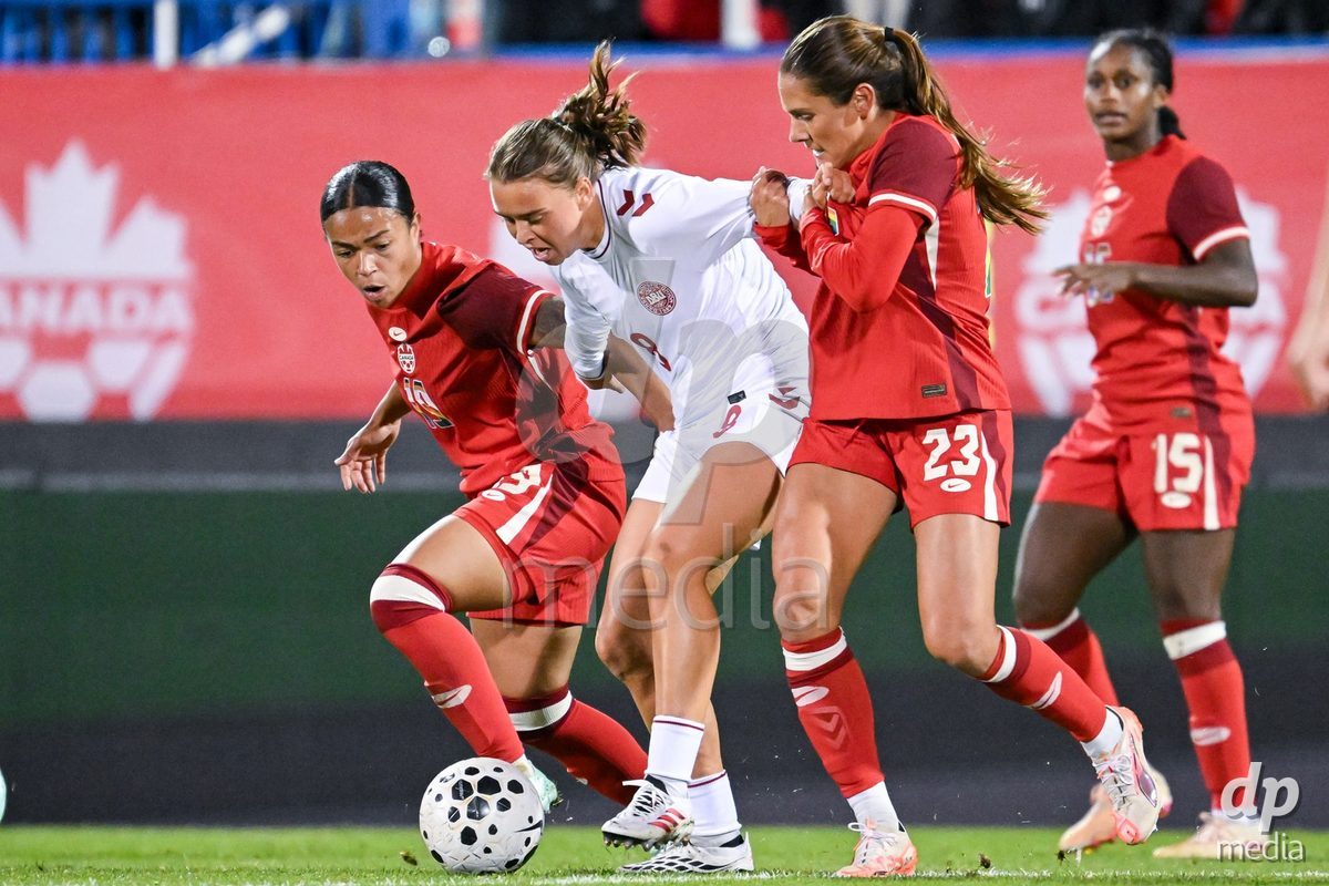 MONTREAL, CANADA - OCTOBER 9: Emma Snerle of Denmark C) battles for the ball during the International Women's Friendly football match between Canada and Denmark at Stade Saputo on October 9, 2026 in Montreal, Canada.