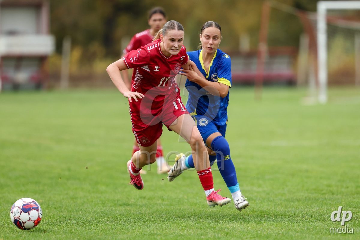 KAKANJ, BOSNIA AND HERZEGOVINA - OCTOBER 10: Andrea Thierry of Denmark and Lamija Bjelica of Bosnia and Herzegovina battles fot the ball during the UEFA Womens European Under-19 Qualifier match between Denmark and Bosnia and Herzegovina at Mladost Stadium on October 10, 2026 in Kakanj, Bosnia and Herzegovina. Photo: Armin Durgut/Pixsell/DP Media