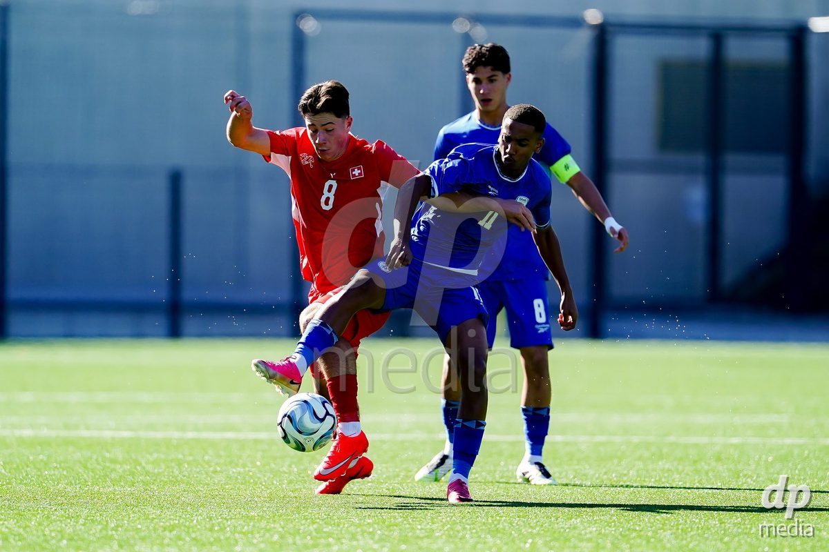 SCHAAN, LIECHTENSTEIN - OCTOBER 12: Maceo Leandro Cottiati of Switzerland and Amit Ayrane of Israel battle for the ball during the UEFA European Under-17 Qualifier match between Israel and Switzerland at LFV Campus Rheinwiese on October 12, 2026 in Schaan, Liechtenstein.