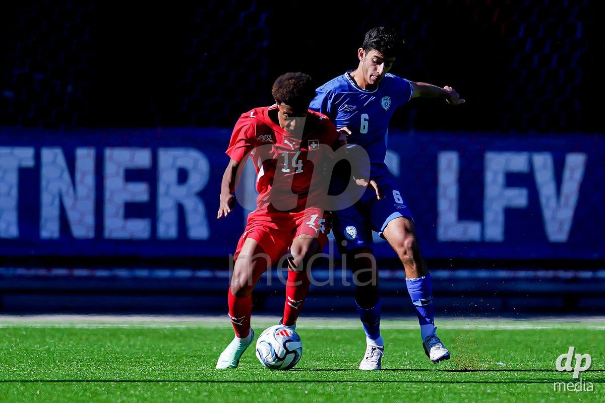SCHAAN, LIECHTENSTEIN - OCTOBER 12: Ryan Hare of Switzerland and Ori Ahel of Israel battle for the ball during the UEFA European Under-17 Qualifier match between Israel and Switzerland at LFV Campus Rheinwiese on October 12, 2026 in Schaan, Liechtenstein.