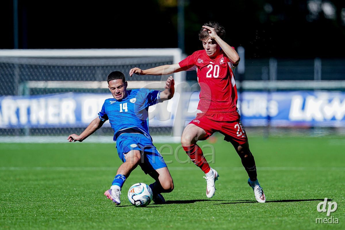 SCHAAN, LIECHTENSTEIN - OCTOBER 12: Loan Thommen of Switzerland and Ben Landau of Israel battle for the ball during the UEFA European Under-17 Qualifier match between Israel and Switzerland at LFV Campus Rheinwiese on October 12, 2026 in Schaan, Liechtenstein.