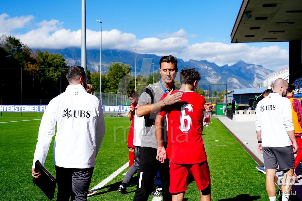 SCHAAN, LIECHTENSTEIN - OCTOBER 12: Ilija Borenovic, Head Coach of Switzerland, and Niklas Zuger of Switzerland after the UEFA European Under-17 Qualifier match between Israel and Switzerland at LFV Campus Rheinwiese on October 12, 2026 in Schaan, Liechtenstein.