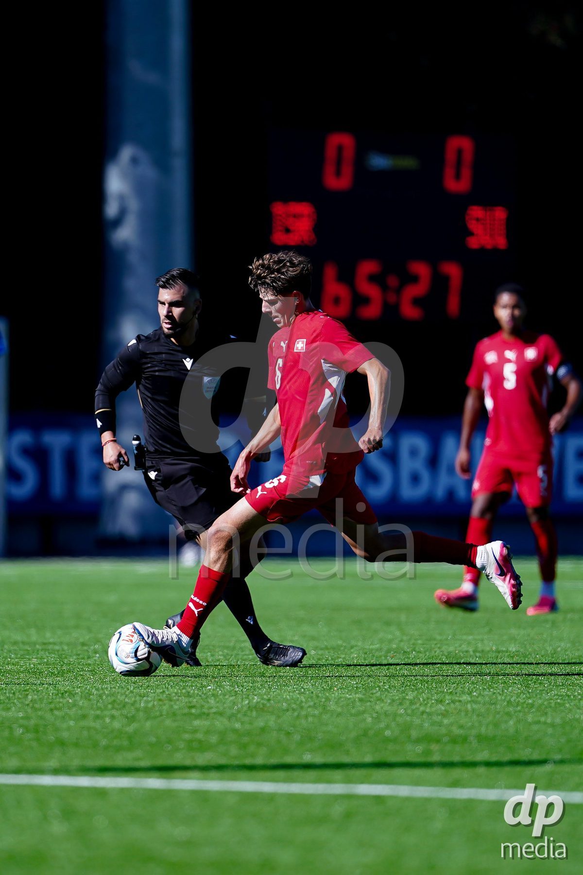 SCHAAN, LIECHTENSTEIN - OCTOBER 12: Niklas Zuger of Switzerland controls the ball during the UEFA European Under-17 Qualifier match between Israel and Switzerland at LFV Campus Rheinwiese on October 12, 2026 in Schaan, Liechtenstein.