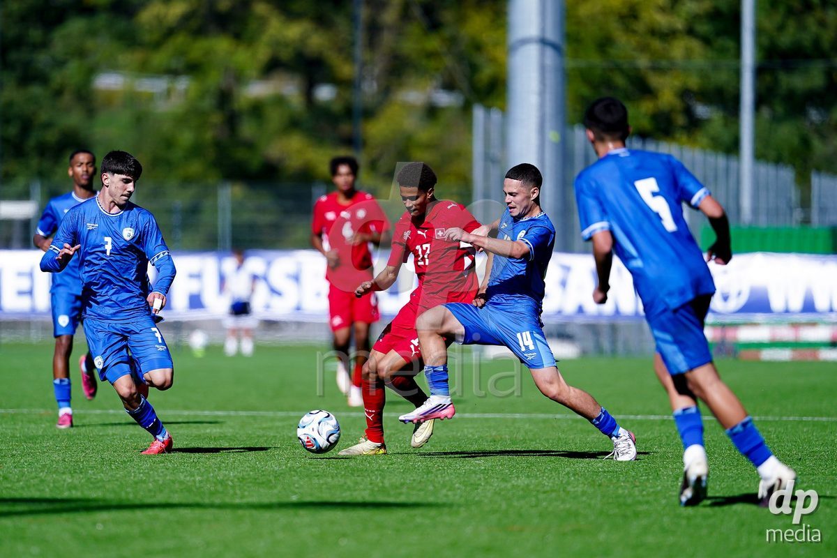 SCHAAN, LIECHTENSTEIN - OCTOBER 12: Kyle Kurt of Switzerland and Ben Landau of Israel battle for the ball during the UEFA European Under-17 Qualifier match between Israel and Switzerland at LFV Campus Rheinwiese on October 12, 2026 in Schaan, Liechtenstein.