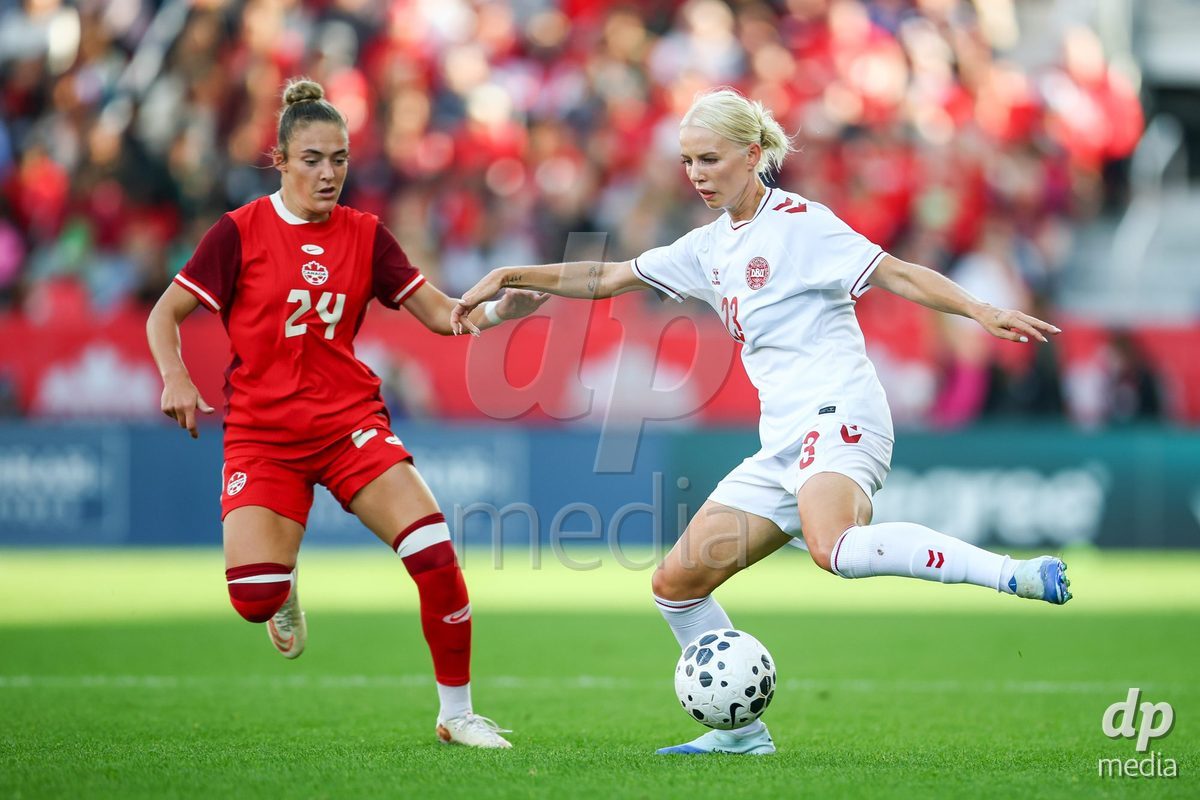 TORONTO, CANADA - OCTOBER 12: Sofie Svava of Denmark (R) and Kaylee Hunter of Canada (L) battle for the ball during the International Friendly match between Canada and Denmark at BMO Field on October 12, 2026 in Toronto, Canada.