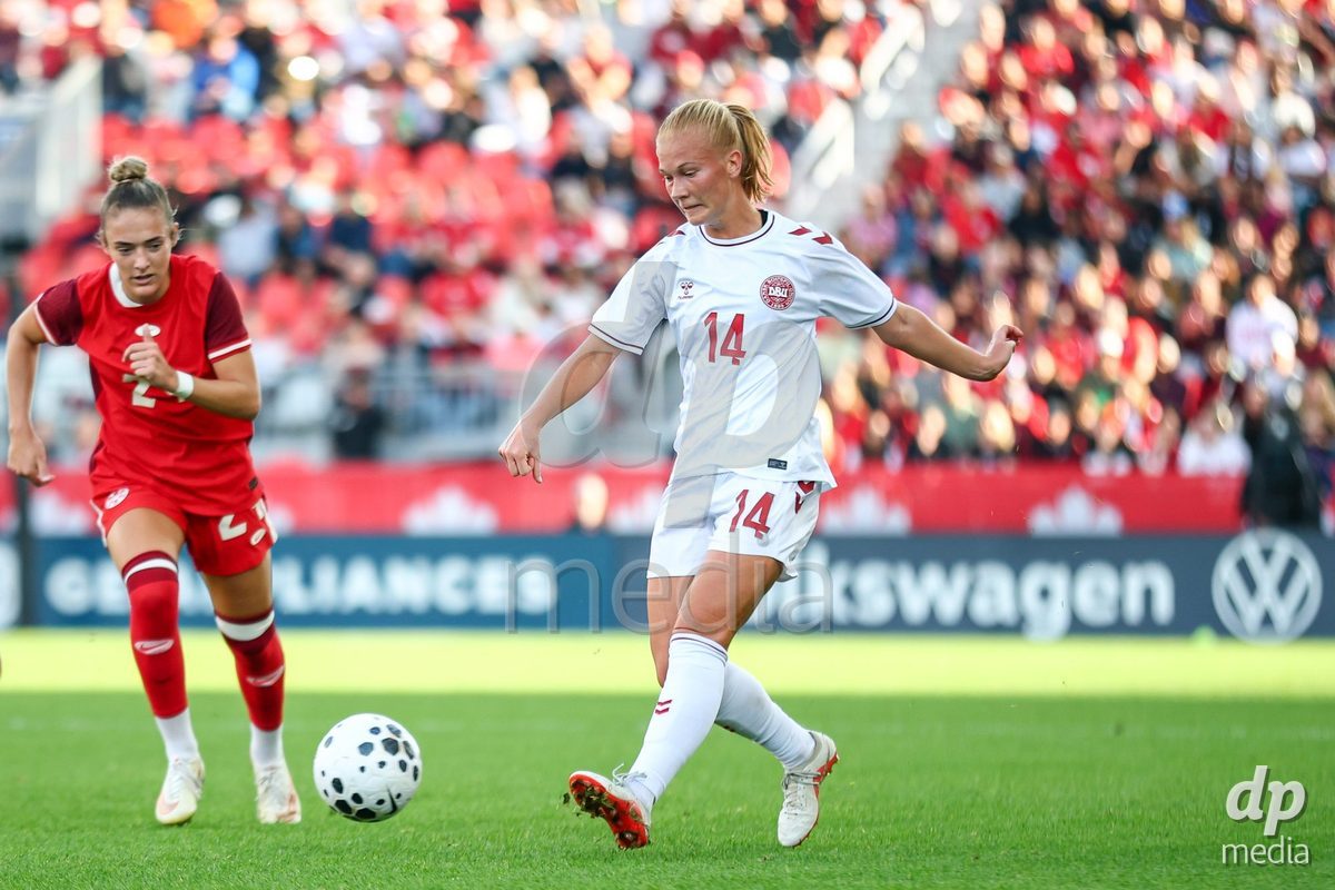 TORONTO, CANADA - OCTOBER 12: Sofie Bredgaard of Denmark (R) shoots the ball during the International Friendly match between Canada and Denmark at BMO Field on October 12, 2026 in Toronto, Canada.