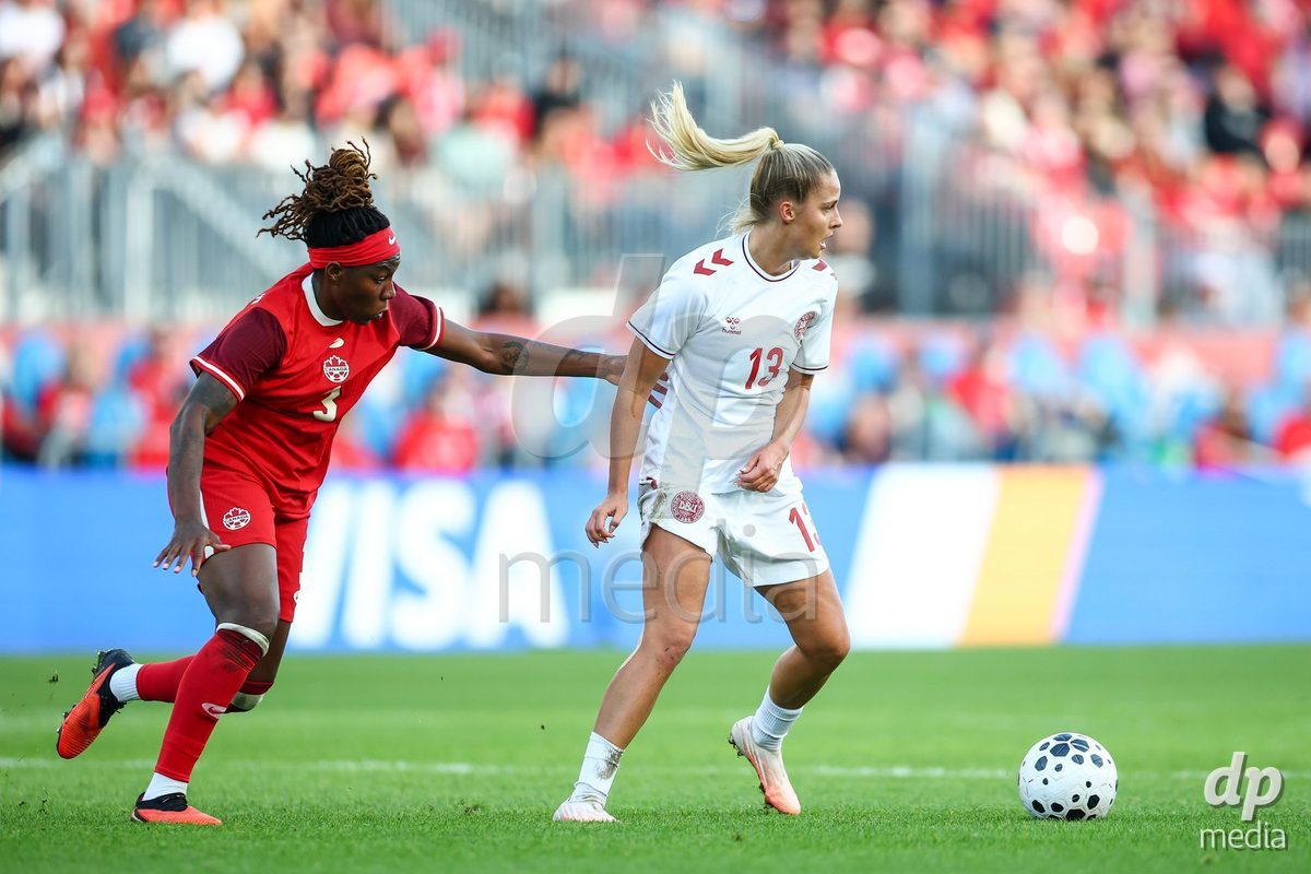 TORONTO, CANADA - OCTOBER 12: Olivia Holdt of Denmark (R) battles for the ball (duel) during the International Friendly match between Canada and Denmark at BMO Field on October 12, 2026 in Toronto, Canada.