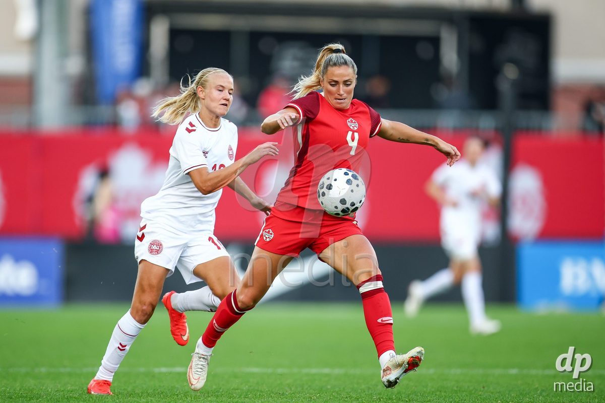 TORONTO, CANADA - OCTOBER 12: Pernille Harder of Denmark (L) and Shelina Zadorsky of Canada (R) battle for the ball (duel) during the International Friendly match between Canada and Denmark at BMO Field on October 12, 2026 in Toronto, Canada.