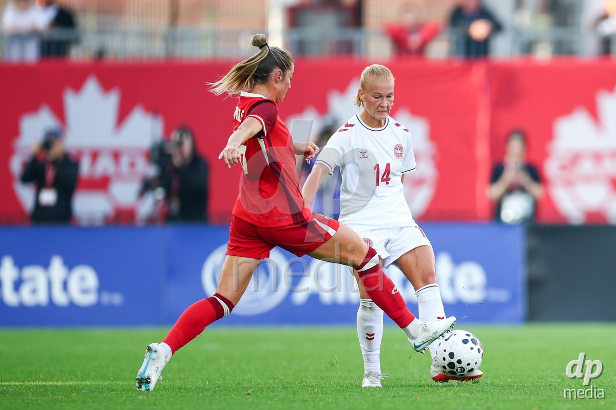 TORONTO, CANADA - OCTOBER 12: Sofie Bredgaard of Denmark (R) battles for the ball (duel) during the International Friendly match between Canada and Denmark at BMO Field on October 12, 2026 in Toronto, Canada.