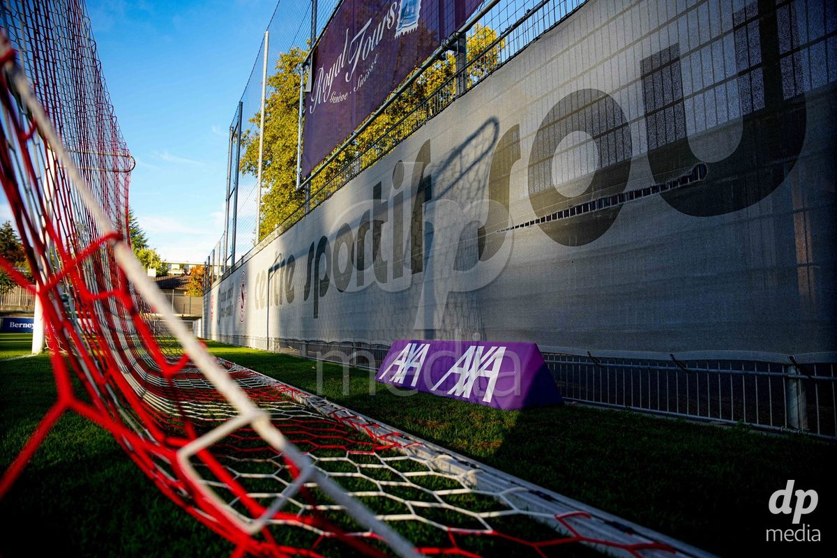 GENEVA, SWITZERLAND - OCTOBER 16: AXA Womens Super League sponsor board during the AXA Women's Super League match between Servette FC Chenois Feminin and FC Luzern at Stade de Trois-Chene on October 16, 2026 in Geneva, Switzerland.