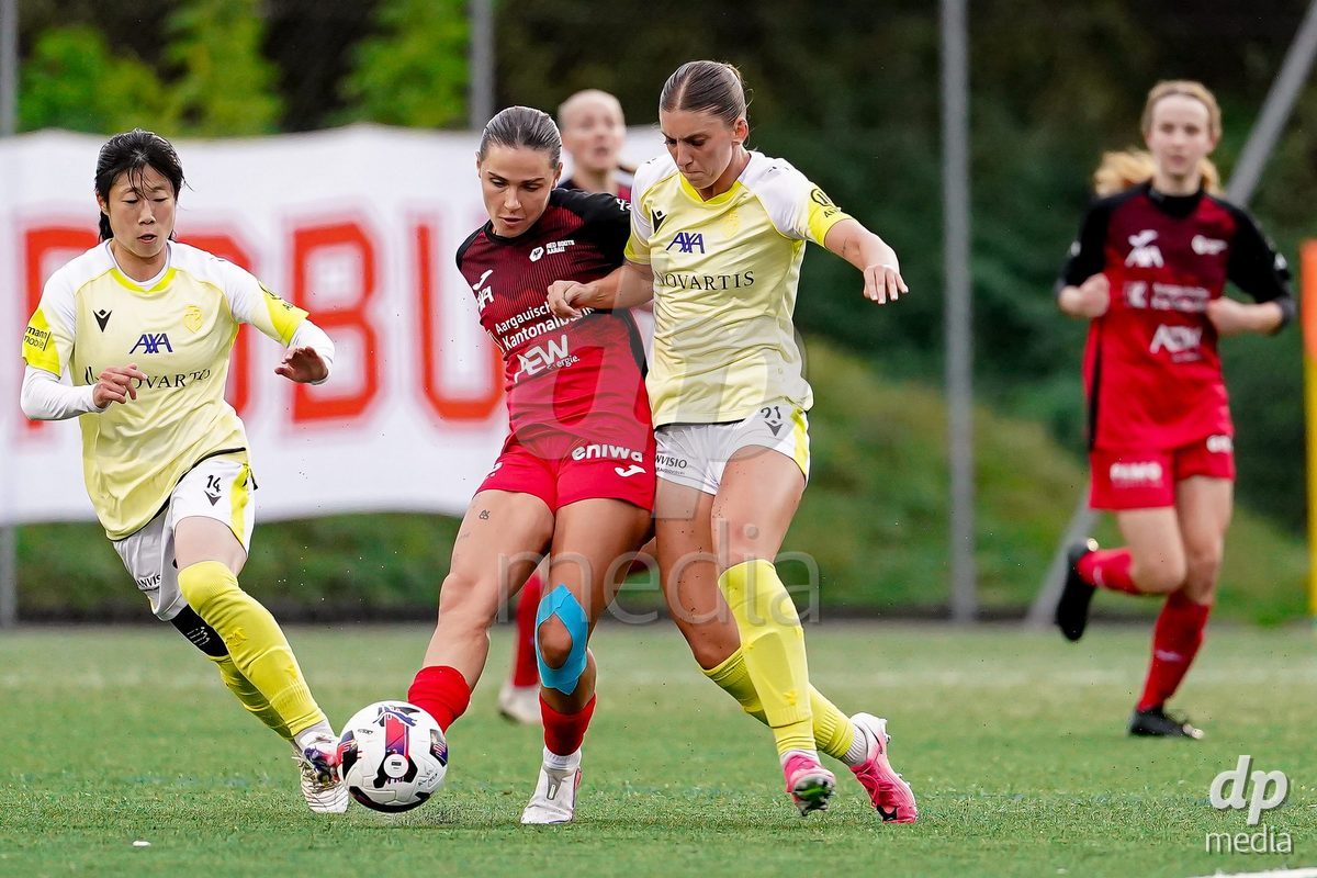 AARAU, SWITZERLAND - OCTOBER 17: Alisa Arthur of FC Basel 1893 and Vanesa Hoti of FC Aarau Frauen battle for the ball during the AXA Women's Super League match between FC Aarau Frauen and FC Basel 1893 at Sportanlage Schachen on October 17, 2026 in Aarau, Switzerland.