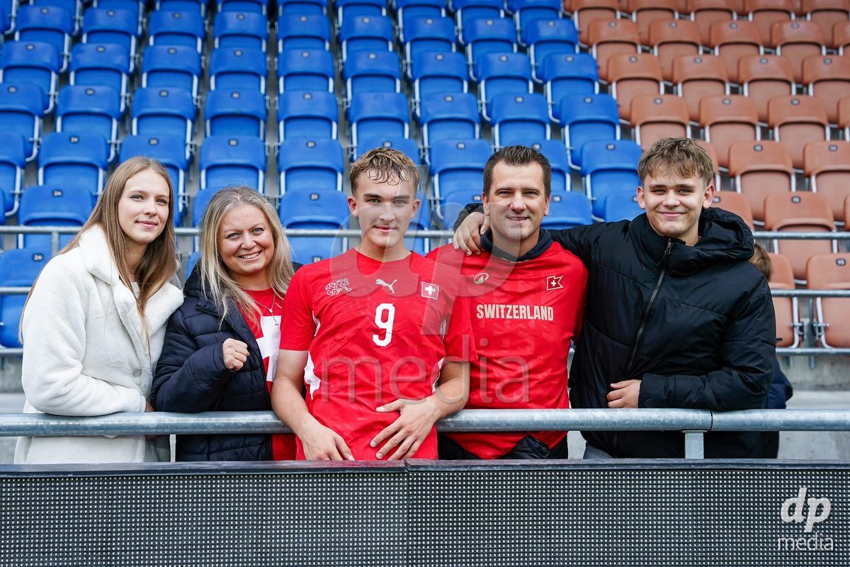 VADUZ, LIECHTENSTEIN - OCTOBER 18: Niko Cavka of Switzerland with family and friends after the victory during the UEFA European Under-17 Qualifier match between Switzerland and Spain at Rheinpark Stadion on October 18, 2026 in Vaduz, Liechtenstein.