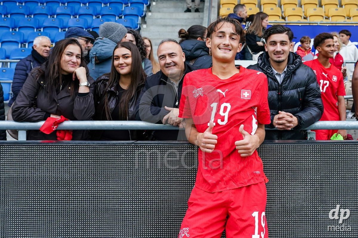 VADUZ, LIECHTENSTEIN - OCTOBER 18: Eron Dreshaj of Switzerland pose for a photo with family and friends after the victory during the UEFA European Under-17 Qualifier match between Switzerland and Spain at Rheinpark Stadion on October 18, 2026 in Vaduz, Liechtenstein.