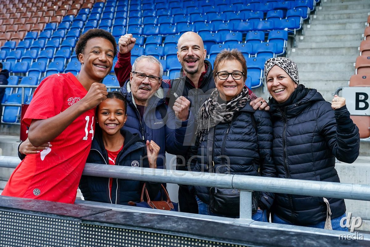 VADUZ, LIECHTENSTEIN - OCTOBER 18: Ryan Hare of Switzerland celebrates after the victory and poses for a photo with family and friends during the UEFA European Under-17 Qualifier match between Switzerland and Spain at Rheinpark Stadion on October 18, 2026 in Vaduz, Liechtenstein.