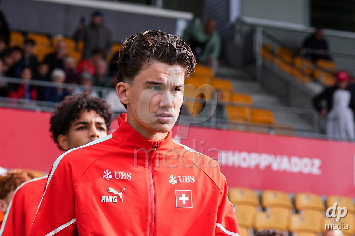VADUZ, LIECHTENSTEIN - OCTOBER 18: Yanis Emch of Switzerland enters for the natioanl anthem prior to the UEFA European Under-17 Qualifier match between Switzerland and Spain at Rheinpark Stadion on October 18, 2026 in Vaduz, Liechtenstein.