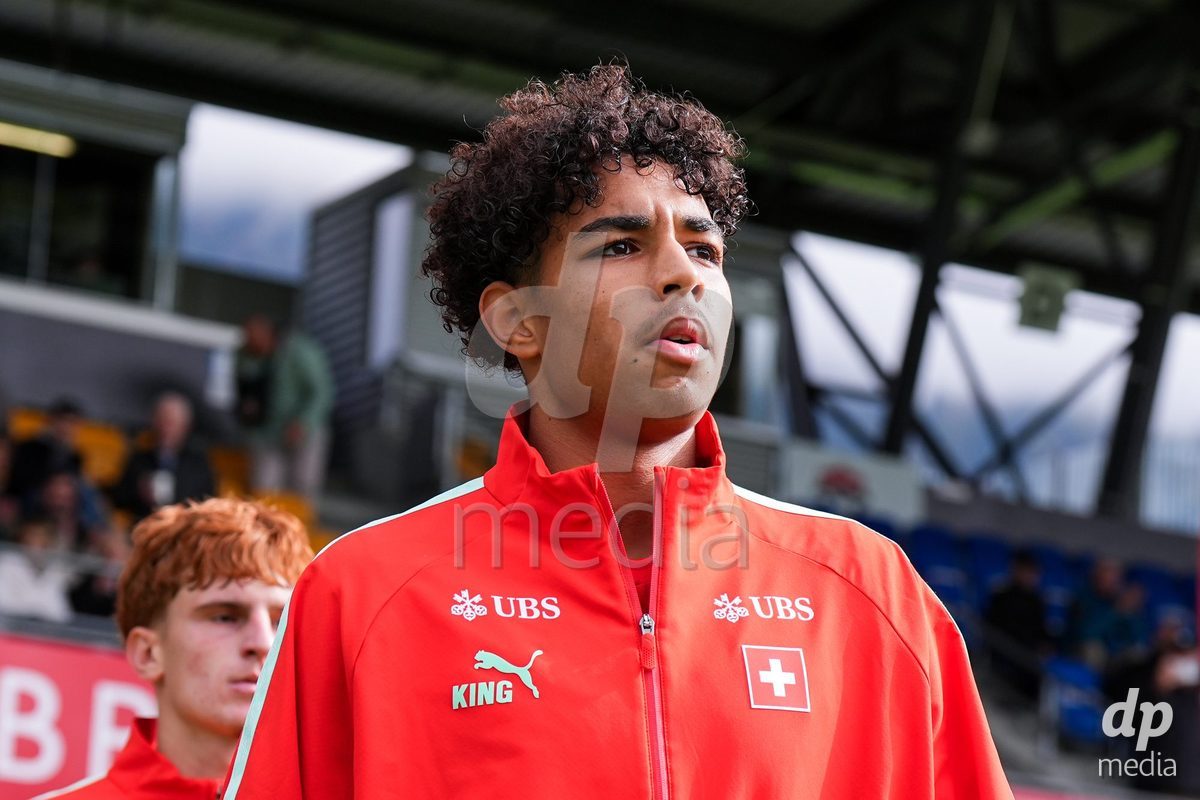 VADUZ, LIECHTENSTEIN - OCTOBER 18: Ifeanyichukwu Onwuzulike of Switzerland enters for the natioanl anthem prior to the UEFA European Under-17 Qualifier match between Switzerland and Spain at Rheinpark Stadion on October 18, 2026 in Vaduz, Liechtenstein.