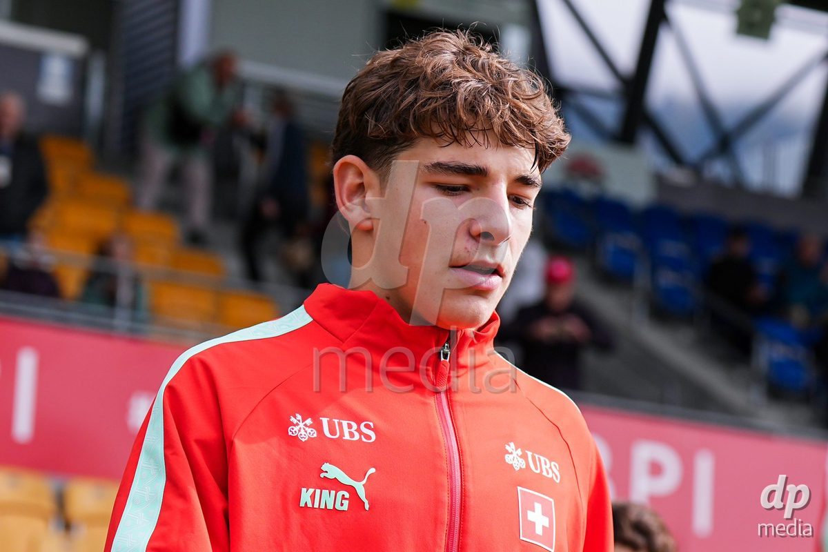 VADUZ, LIECHTENSTEIN - OCTOBER 18: Niklas Zuger of Switzerland enters for the natioanl anthem prior to the UEFA European Under-17 Qualifier match between Switzerland and Spain at Rheinpark Stadion on October 18, 2026 in Vaduz, Liechtenstein.